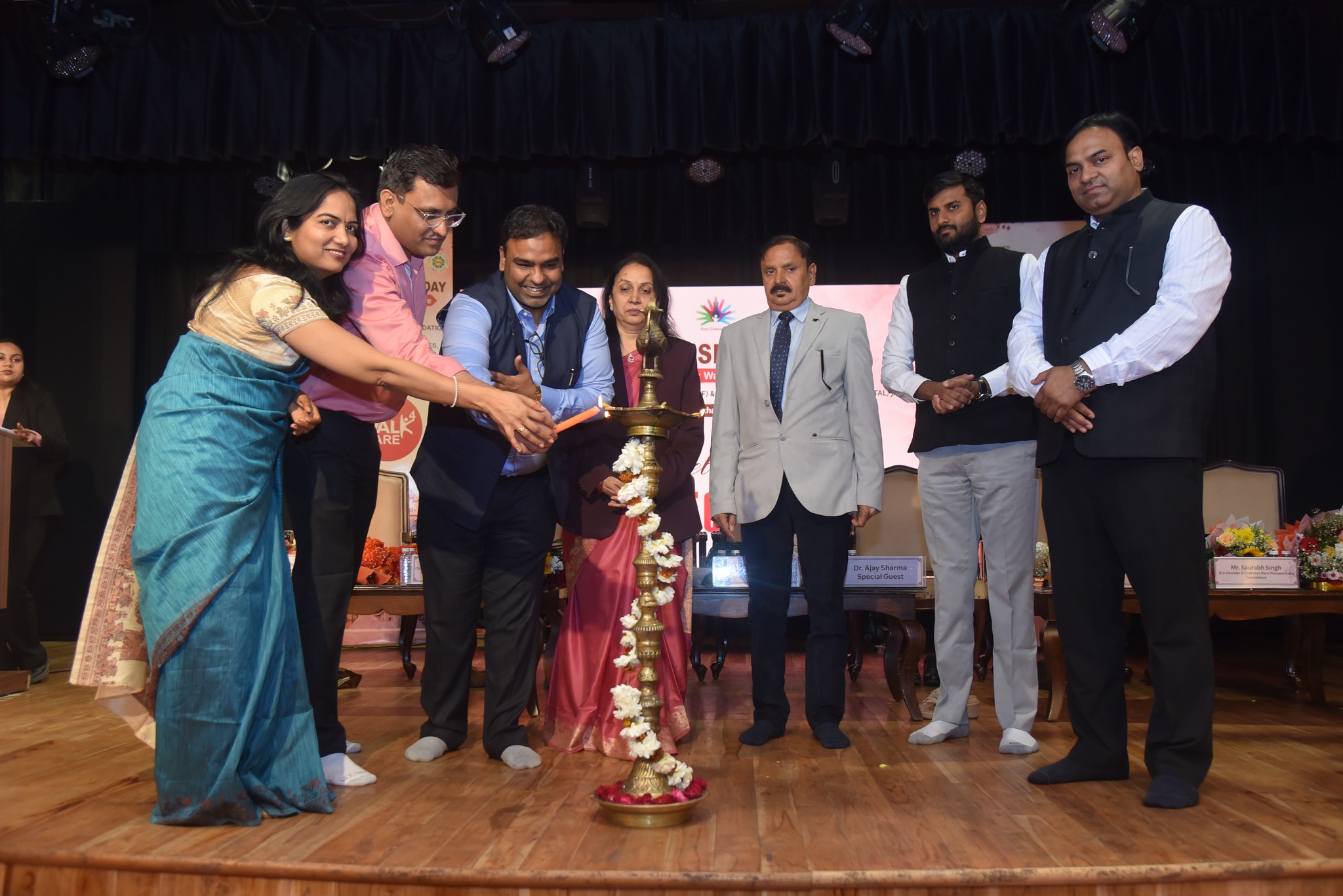 A group of attendees lighting candles in solidarity.